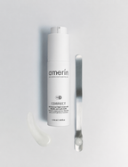A AHA Renewal Night Cream with Glycolic and Lactic Acids bottle with a white applicator tip, shown on a light gray background next to a silver spatula and a small smear of white cream.