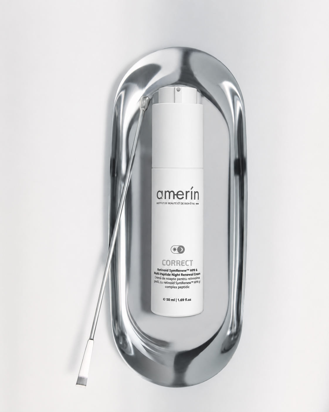 A white Amerín CORRECT_Night Cream with HPR retinoidand Peptides SYN-TC bottle displayed inside a polished silver metallic frame on a light gray background.