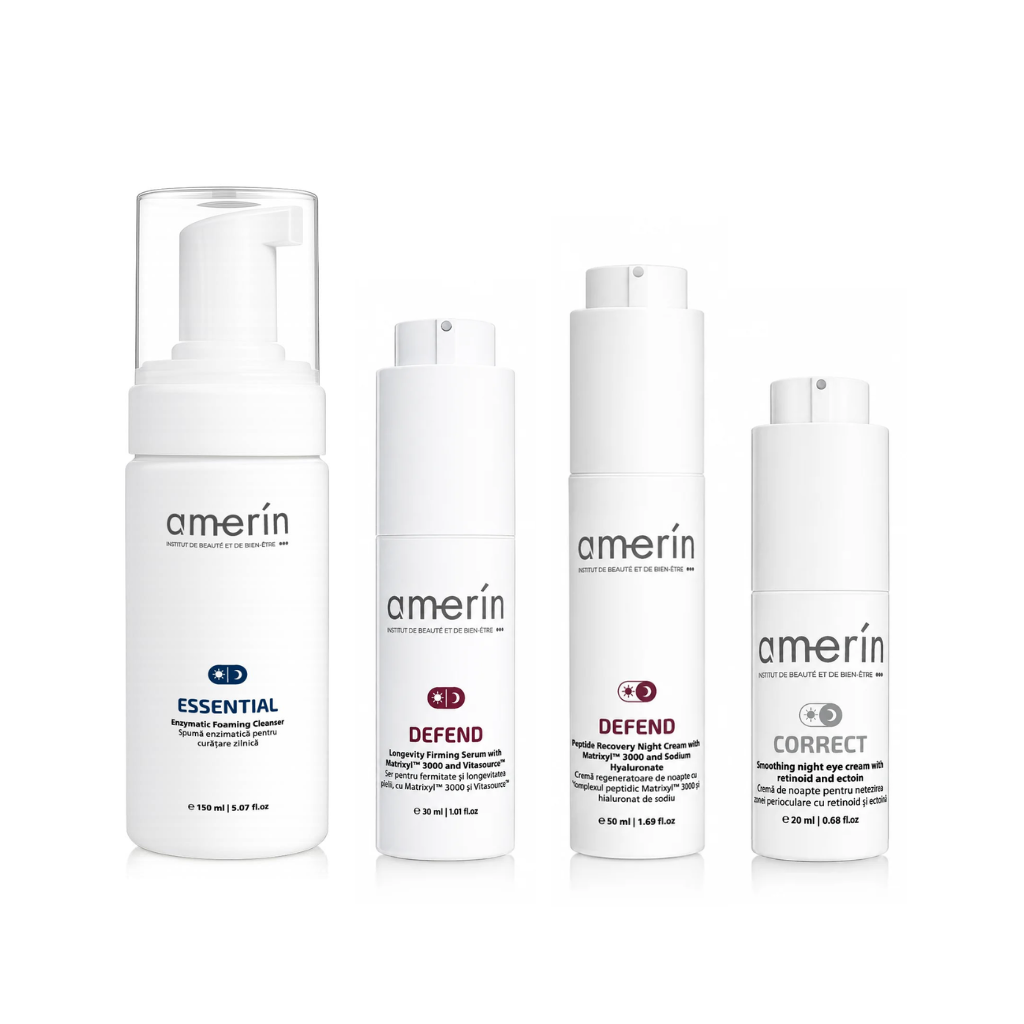 Four white Amerín skincare bottles and pump containers arranged in a row on a white background, including Essential, Defend, and Correct lines.